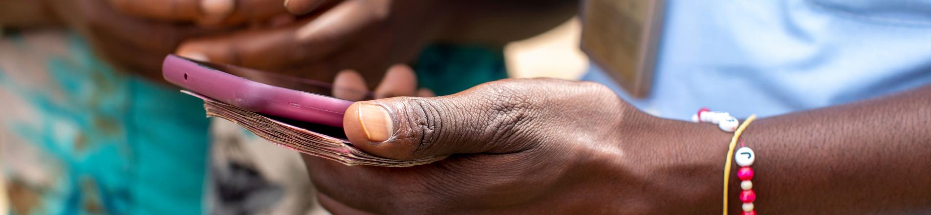 women using mobile money in Africa