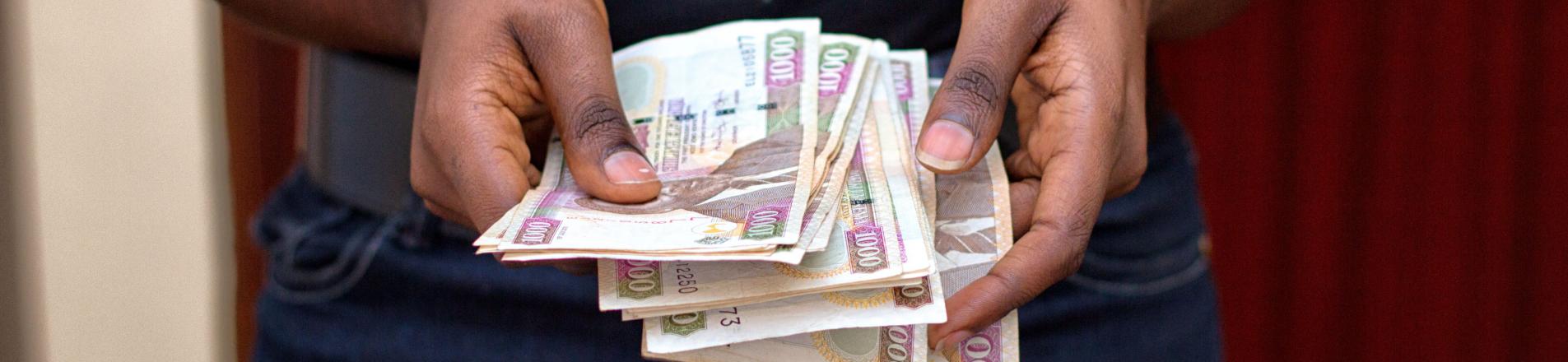 woman in kenya counting money