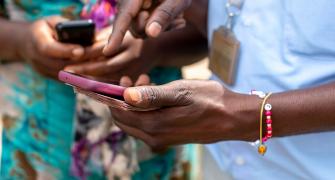 women using mobile money in Africa