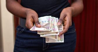 woman in kenya counting money