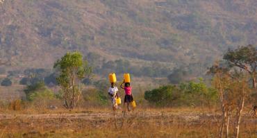 Girls carrying water