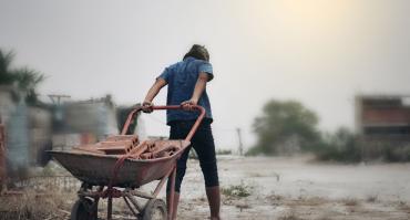child at work, reflecting this articles theme of reducing child labour in Bolivia
