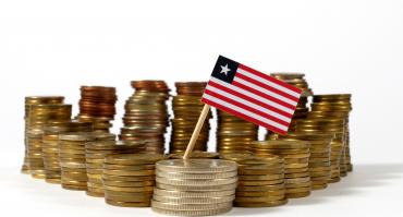 Coins with Liberian flag, symbolizing tax collection