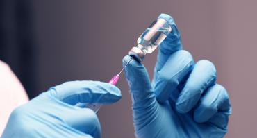 healthcare professional administering a vaccine