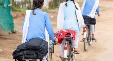 Girls in India on bicycles