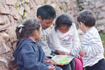 children looking at book